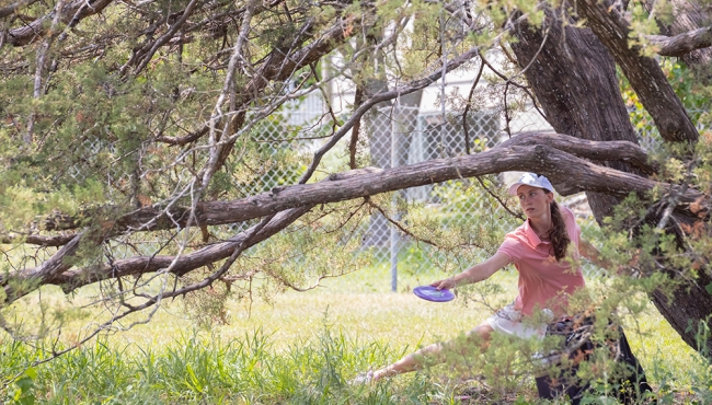 Ann throws from inside a tree