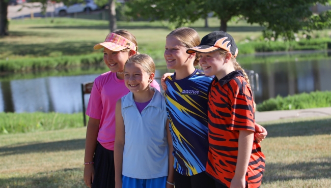 Four players pose for a photo