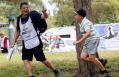 Cole Kresge runs off the tee after his hole 18 ace as his dad/caddie cheers him on