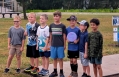 Kids in the MJ08 division pose for a group photo on Hole 1 