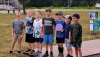 Kids in the MJ08 division pose for a group photo on Hole 1 