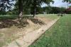 Hole 1. 256 ft.There is a tree mid way on the right hand side. Behind the basket are some trees.